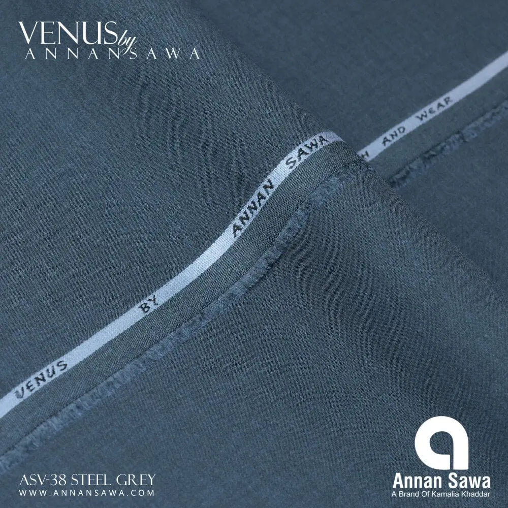 Close-up of steel grey wash and wear fabric with Annan Sawa branding.